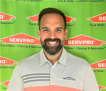 man in front of backdrop